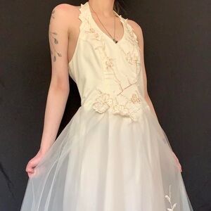 White tulle wedding dress with golden straw floral appliqué halter top